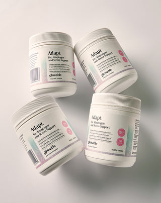 Four containers of Glowable Adapt on a white background